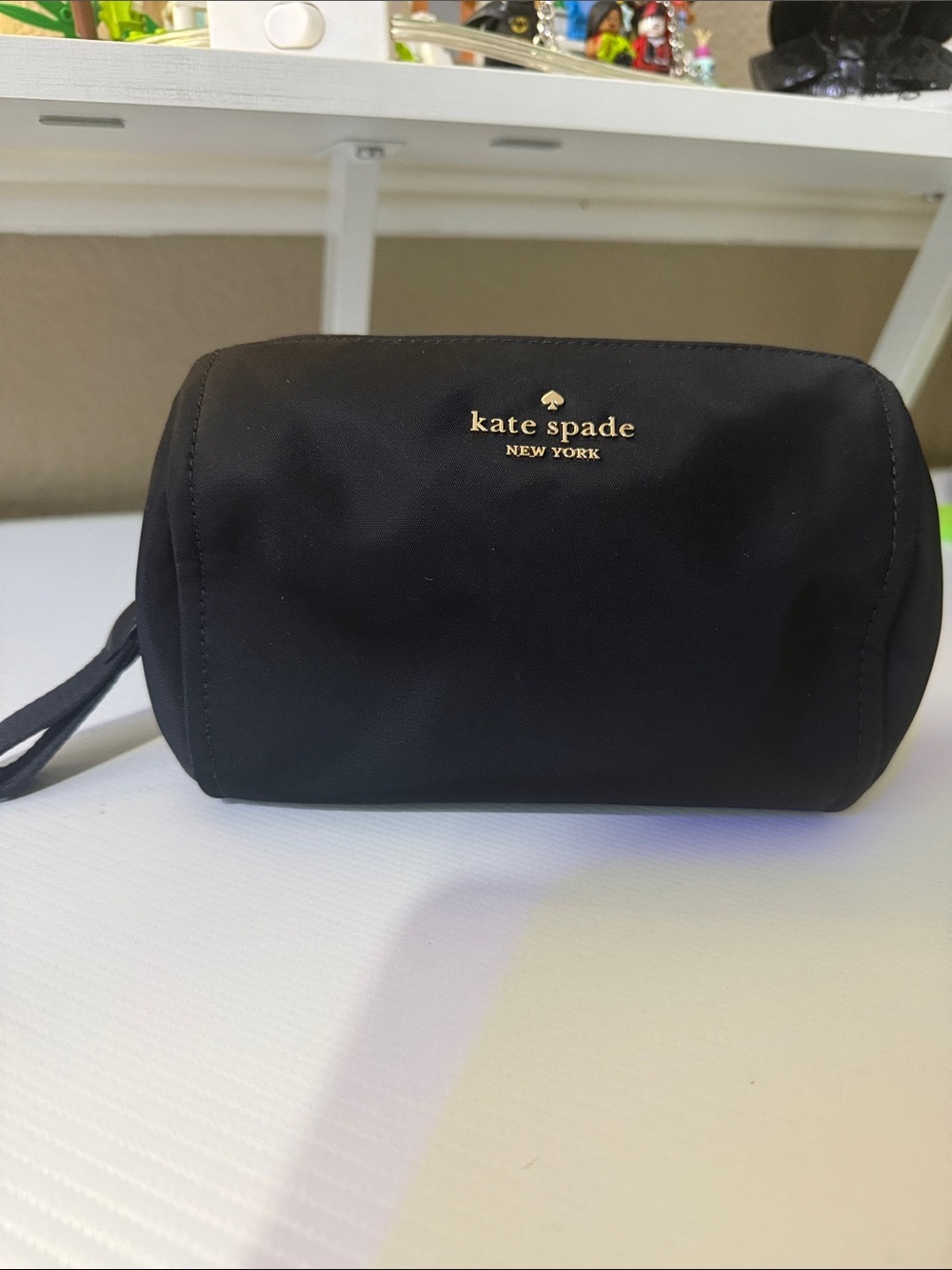 kate spade black nylon cosmetic wristlet with gold logo